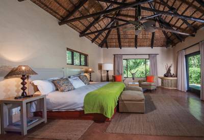 Spacious thatched safari suite with air conditioning at Kariega River Lodge Kariega Game Reserve