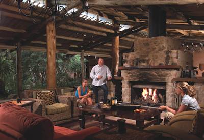 Central lounge with rustic brick fireplace at Kariega Ukhozi Lodge Kariega Game Reserve Eastern Cape