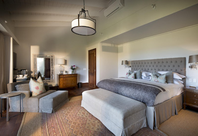 Elegantly appointed suite with African-inspired decor at Kwandwe Fort House Kwandwe Reserve
