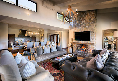 Spacious lounge with large fireplace at Kwandwe Fort House Kwandwe Private Game Reserve