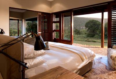 En-suite bedroom with expansive veranda and bushveld views at Kwandwe Melton Manor Eastern Cape
