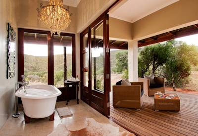 Deep bathtub with panoramic bushveld views at Kwandwe Melton Manor Kwandwe Private Game Reserve
