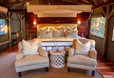 Elegantly appointed en-suite bedroom in canvas safari tent at Lalibela Tree Tops Lodge Eastern Cape
