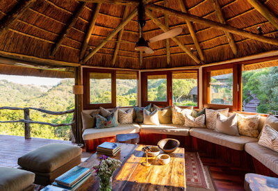 Thatched lounge with waterhole views at Lalibela Tree Tops Lodge Lalibela Private Game Reserve