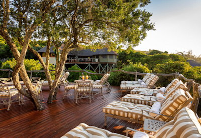 Outdoor al fresco dining deck overlooking waterhole at Lalibela Tree Tops Lodge Eastern Cape