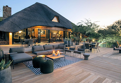 Shamwari Bayethe Tented Lodge stone and thatch design overlooking waterhole Shamwari Game Reserve