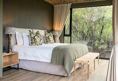 Luxury tented suite interior with fireplace at Shamwari Bayethe Tented Lodge Eastern Cape