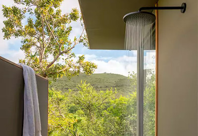 Central guest lounge with fireplace at Shamwari Bayethe Tented Lodge Shamwari Private Game Reserve