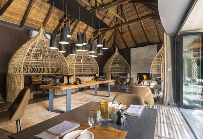 Luxury air-conditioned safari suite with wall-to-wall glass doors at Shamwari Eagles Crag Lodge