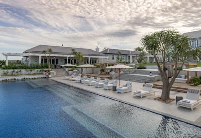 Large rim-flow swimming pool and sun deck at Shamwari Long Lee Manor Shamwari Game Reserve
