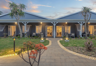 Covered outdoor boma dining area with Bushmans River views at Shamwari Riverdene Family Lodge
