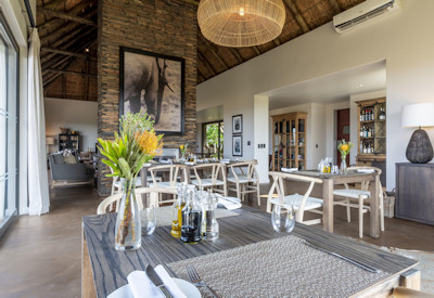 Outdoor dining deck with sweeping Shamwari Game Reserve vistas at Shamwari Sarili Lodge