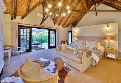 Luxurious thatched junior suite with private patio at Shamwari Lobengula Lodge Eastern Cape