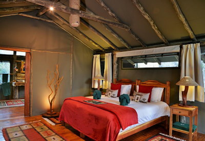 Tented suite with exquisite linen and locally sourced textiles at Sibuya Forest Camp Eastern Cape