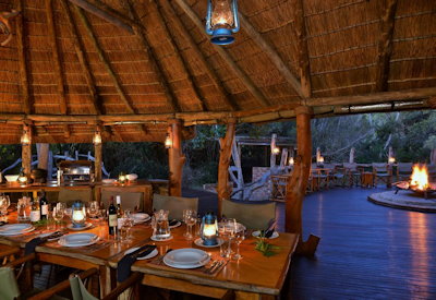 Thatched indoor dining room and bar at Sibuya Forest Camp Sibuya Private Game Reserve