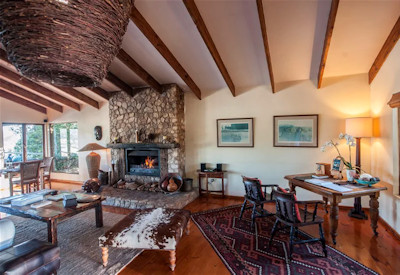 Lounge area with fireplace and writing desk