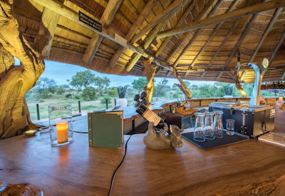 Central thatched guest area with viewing deck