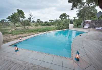 Infinity swimming pool with sun loungers