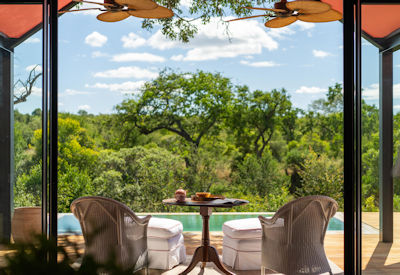 Plunge pool surrounded by African wilderness