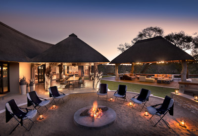 Thatched outdoor guest spaces and dining areas