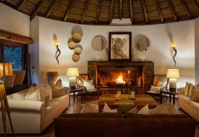 Thatched lounge area and fireplace