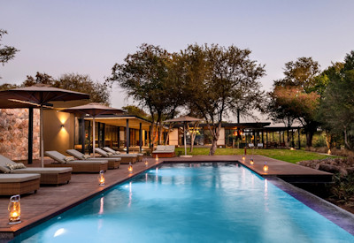 Large infinity pool with sunloungers