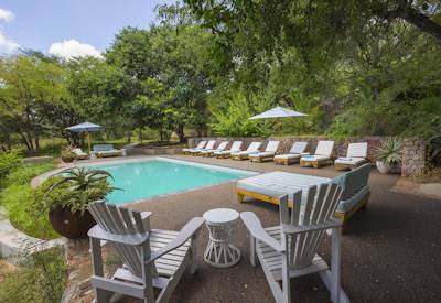 Small swimming pool with sun loungers