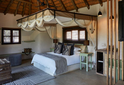Luxury thatched safari suites with private pool deck