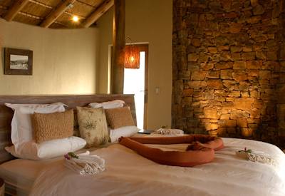 Wooden verandah with views over Madikwe plains at Buffalo Ridge Safari Lodge
