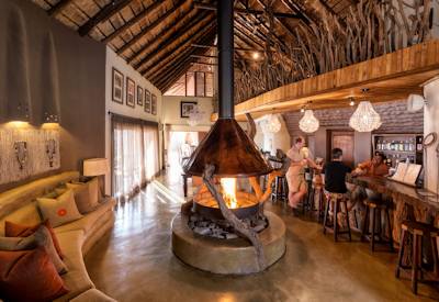 Thatched central guest lounge and dining area at Impodimo Game Lodge Madikwe Game Reserve