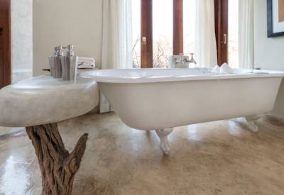 Luxury bathroom with large bathtub at Impodimo Game Lodge Madikwe Game Reserve