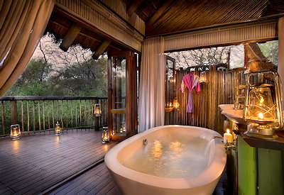 Luxury stone bathtub in treehouse suite at Jaci's Tree Lodge Madikwe Game Reserve
