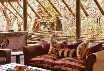 Central guest lounge area with fireplace at Jaci's Tree Lodge Madikwe Game Reserve