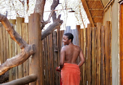 Private outdoor shower with forest views at Jaci's Tree Lodge Madikwe Game Reserve