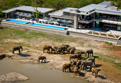 Sofa safari lounge overlooking private waterhole at Jamala Madikwe Royal Safari Lodge