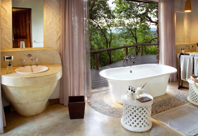 Freestanding bathtub in luxury suite at Madikwe Hills Game Lodge