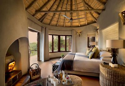 Thatched-roof suites blending into the natural surroundings
