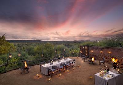 Outdoor dining setup under a starry night sky