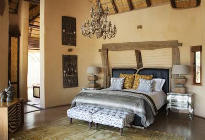 Luxurious bedroom in safari suite at Molori Safari Lodge Madikwe