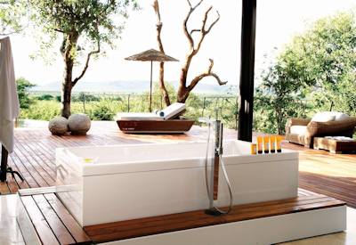 Open-air bathtub in luxury suite at Molori Safari Lodge Madikwe Game Reserve