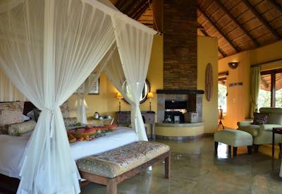 Spacious luxury bedroom with wrap-around deck at Motswiri Safari Lodge Madikwe