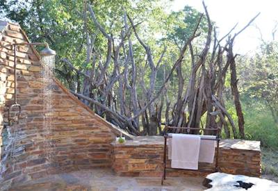 Outdoor shower in private suite at Motswiri Safari Lodge Madikwe Game Reserve