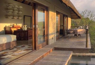 Private deck and plunge pool overlooking Phinda bushveld at AndBeyond Phinda Mountain Lodge