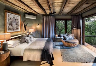 Supremely spacious luxury suite with king-size bed at AndBeyond Phinda Rock Lodge Zululand