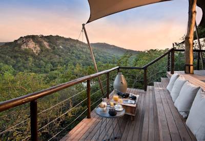 Romantic bathtub for two in en-suite bathroom at AndBeyond Phinda Rock Lodge KwaZulu-Natal