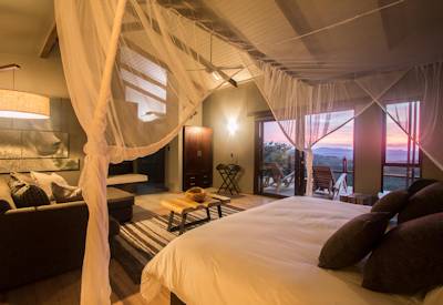 Safari suite perched high on ridge with Hluhluwe Game Reserve views at Rhino Ridge Lodge