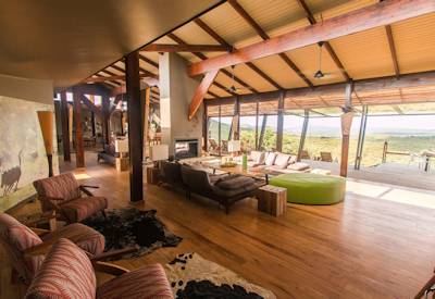 Central guest lounge with floor-to-ceiling views at Rhino Ridge Safari Lodge Hluhluwe