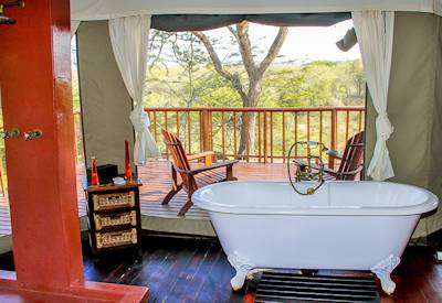 Romantic Victorian freestanding bathtub in tented suite at Thula Thula Tented Camp Zululand