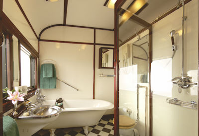 Rovos Rail Royal Suite clawfoot bath glass shower Southern Cross luxury train safari