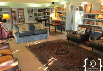 Kurland Hotel Plettenberg Bay English manor house African elements family portraits horseshoe farmstead Garden Route